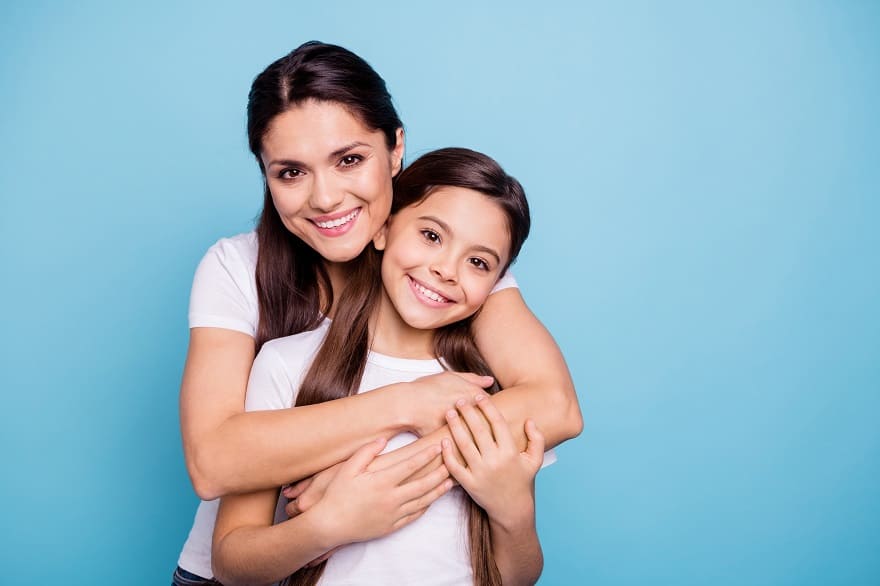 Moving to the UK - Beautiful Mother and Daughter on blue background